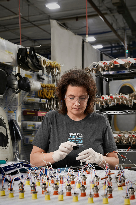 Portrait of employee working in an air-to-air refueling and environmental systems manufacturing facility in Davenport, Iowa