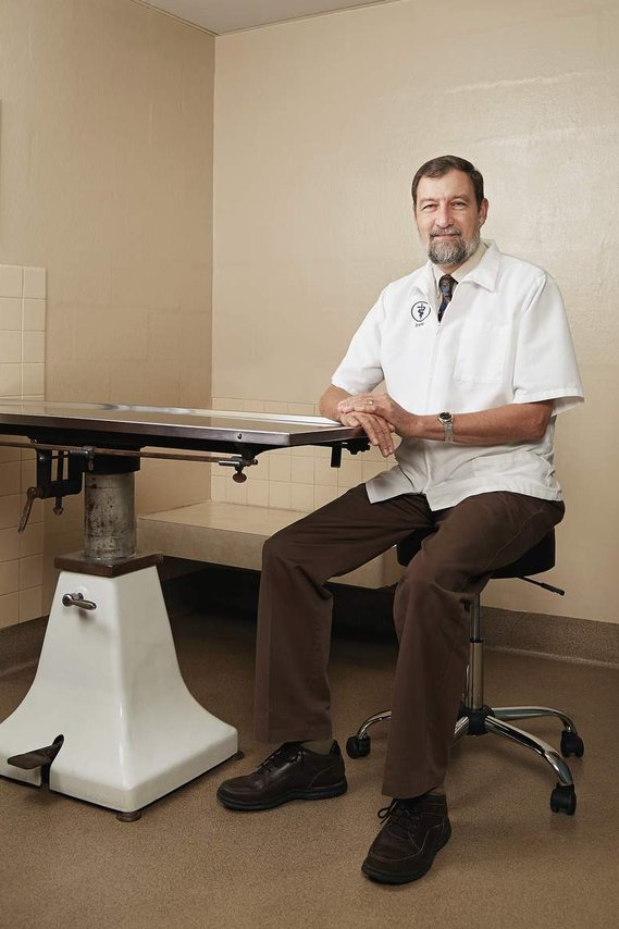 Veterinary Photographer in Madison, Wisconsin. Portrait of Doctor of Veterinary Medicine in exam room