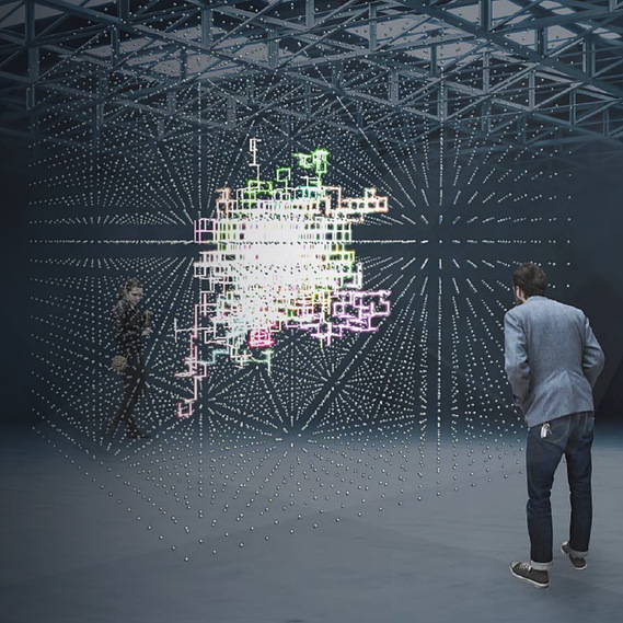 A mockup showing a 3D projection in a large warehouse space of the grid of dots and many, overlapping, multicoloured trails within in it. Two people peer into the projection from the outside. 