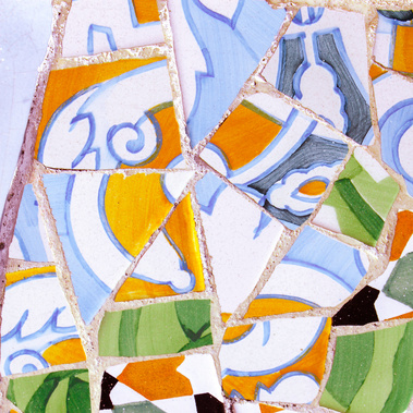 Abstract close-up detail of broken up square blue, orange, white and green geometric-shaped tile work at Park Guell by the famed architect Antoni Gaudi color photo fine art print 