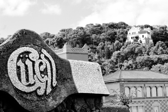 Black and white close up details of Park Guell tile work set against the large villas of the hills of Barcelona Spain fine art photo print