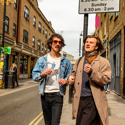 'Two Friends Walking Down Brick Lane and Having a Good Chat, London Street Photography Colour'