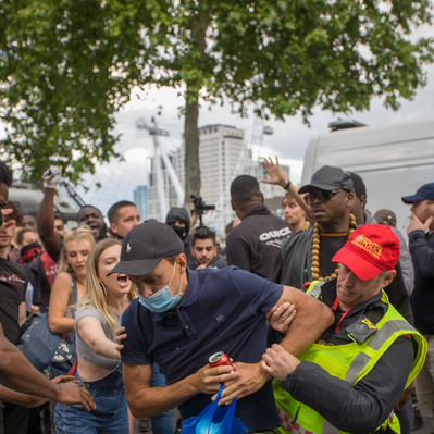 'A Protester clash's with a Met Police officer at the Black Lives Matter Protests, London Street Photography Colour,
