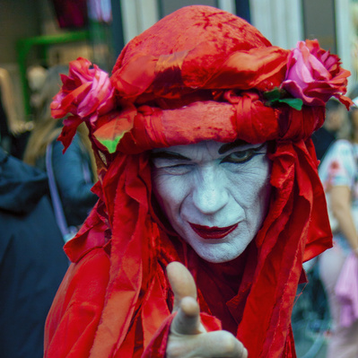 'Extinction Rebellion Protester Dressed in Red Robes, London Colour Street Photography'