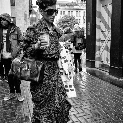 Man walking down Carnaby Street, Soho, London black-and-white photography