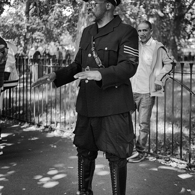 Man dressed up in a uniform speakers corner London black-and-white photography