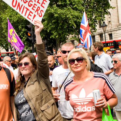 'Tommy Robinson Protesters Waving Placards in Trafalgar Square, London Colour Street Photography'