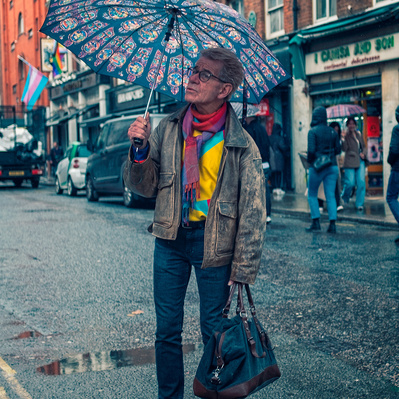 Man holding umbrella Soho Street Photography colour