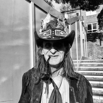 man smoking a pipe. North London. black & white photography