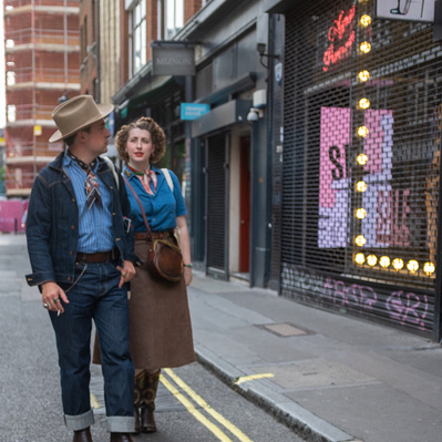 Couple walking down the street in Soho London colour photography