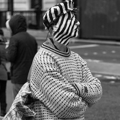 Street performer dressed with Zebra face paint, London, Black and White Photography .