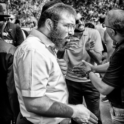 A Jewish man debating at speakers corner London black-and-white photography