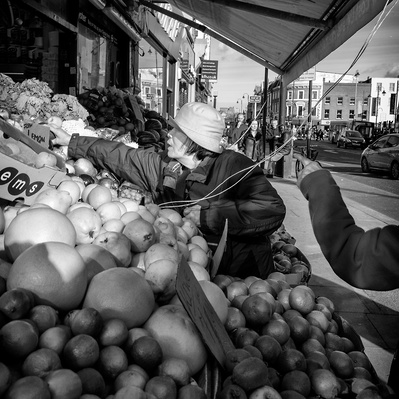 'Chinese lady shopping for a lemon' tooting South London black-and-white photography