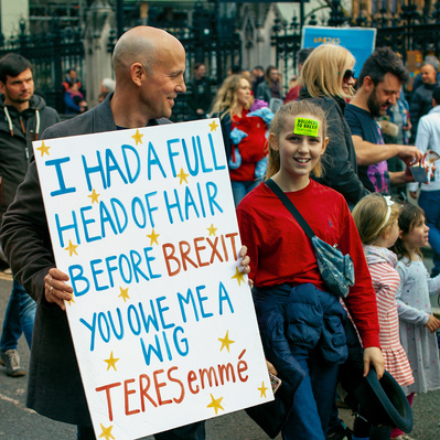 'Pro Europe Protesters with funny placard walking past the Houses of Parliament, London Colour Street Photography'
