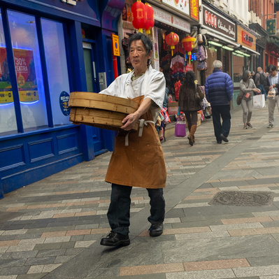 'Chinese man carrying baskets in china town London, London Street Photography Colour' 