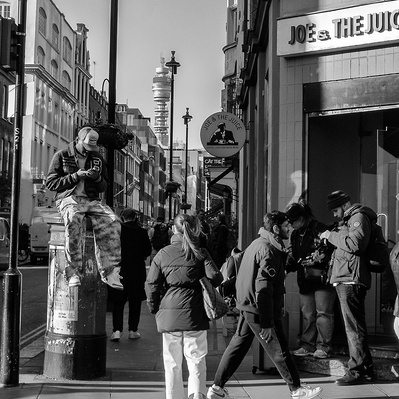 Sitting on post box, Soho London Street photography black and white
