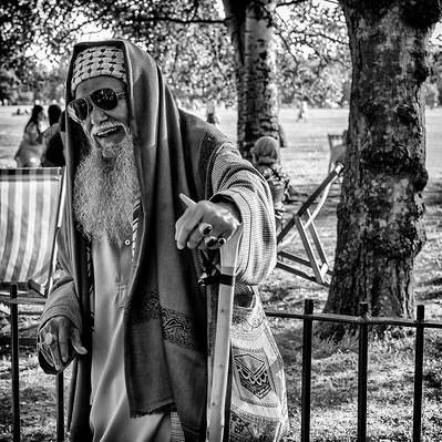 An older man and wise man speakers corner London black-and-white photography