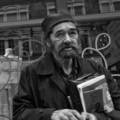 Rough sleeper with books, Richmond black-and-white photography