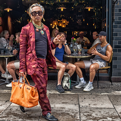 Man in very colourful suits in Soho London colour photography