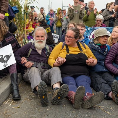 'Extinction Rebellion Protesters sitting in the road on Waterloo Bridge, London Colour Street Photography'