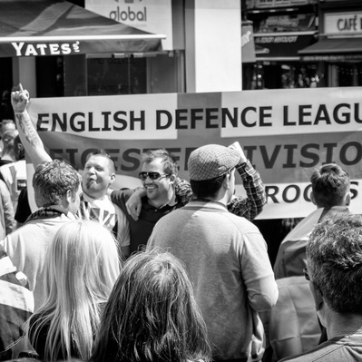 'EDL Protesters posing by an EDL flag, London Black and White Street Photography'