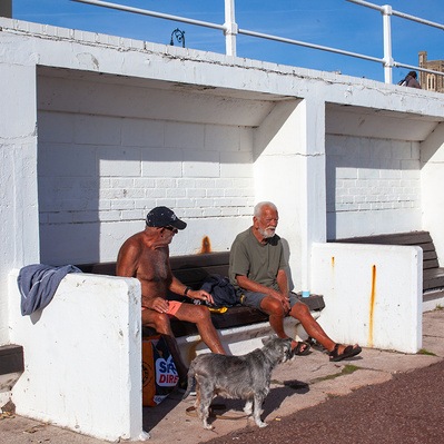 Two men in a sun shelter, Worthing, Sussex, England colour photography