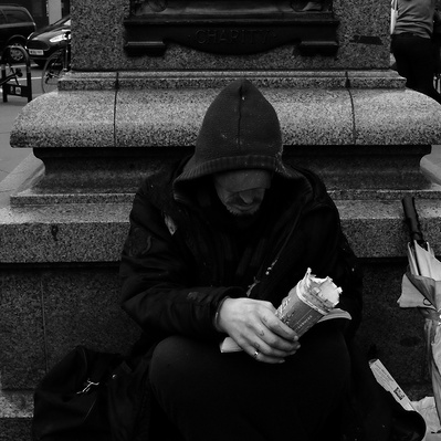 Rough sleeper, hoping for some money, Tooting South London black-and-white photography