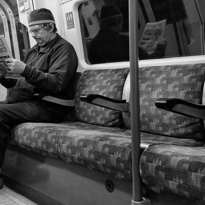 'Man reading the paper on the tube, Black & White London Street  Photography'