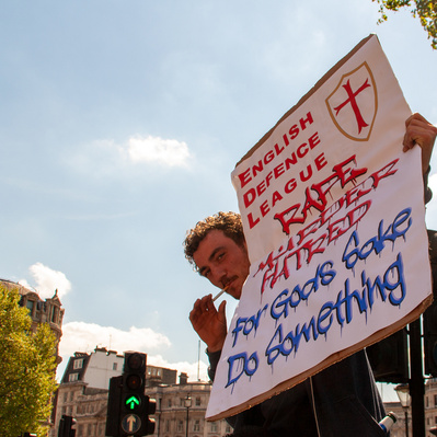 'EDL supporter holding up a placard in Trafalgar Square, London Colour Street Photgraphy'