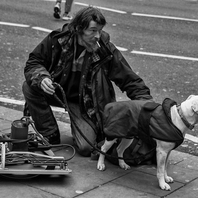 A rough sleeper with his dog London black-and-white photography