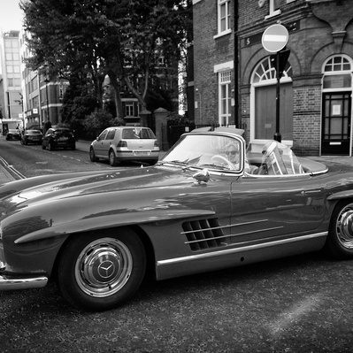 'A woman driving an open top mercedes, Black & White London Street Photography'