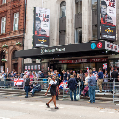 'Young Lady walks past Tommy Robinson Supporters, Central London Colour Street Photography'