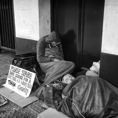 Two men advertising for a bed for the night Tooting South London black-and-white photography