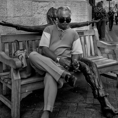 Man sitting on a bench, Carnaby Street, London colour photography