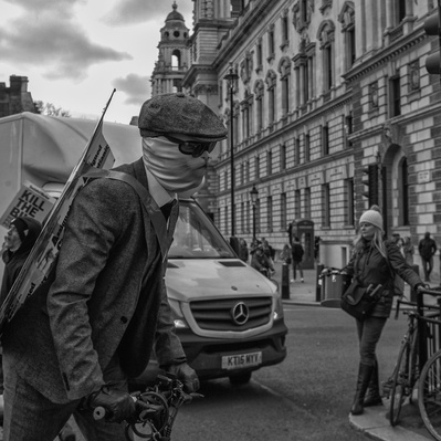 'Kill the Bill Protester with a cat mask outside Parliament , London Street Photography Black and White'