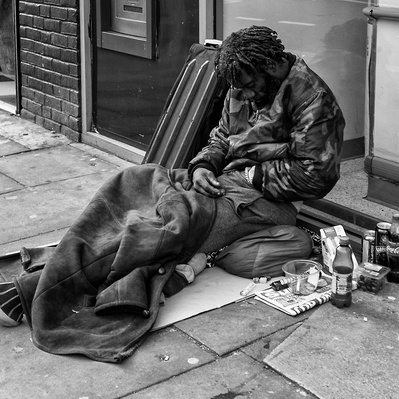 Hard Times, man trying to keep warm - London Black and White Street Photography