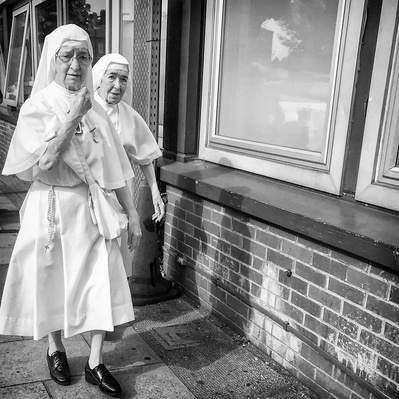 Two nuns visiting St Georges Hospital - South London. black & white photography