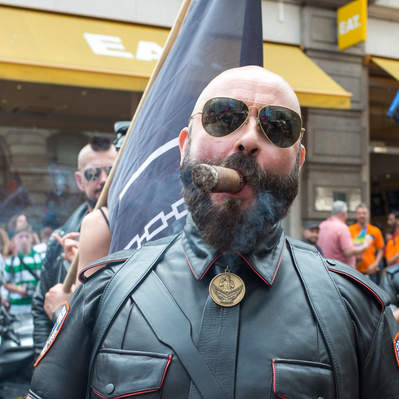 Man smoking cigar, gay pride, London street photography Color 