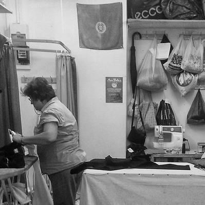 Two seamstresses Tooting Broadway market. Black-and-white photography.