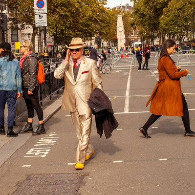 'man walking along Whitehall wearing a Gold Suit, London Colour Street Photography'