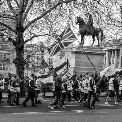 'Pro Brexit Supporters walk past Trafalgar Square, London, Black and White Street Photography'