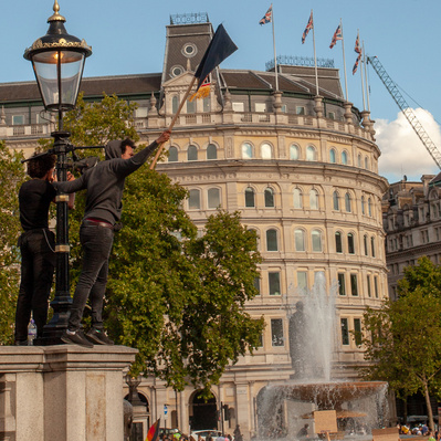 'Protester Waving a Flag at the Black Lives Matter Protests, London Colour Street Photography'