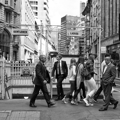 'People walking past old style public toilets, Black and White London Street Photography'
