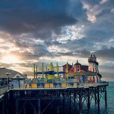 A colour photograph of a funfair on the end of Brighton Pier, Sussex England colour photography