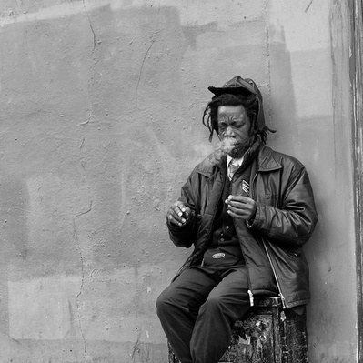 A Rasta joined his smoke, Notting Hill London black-and-white photography
