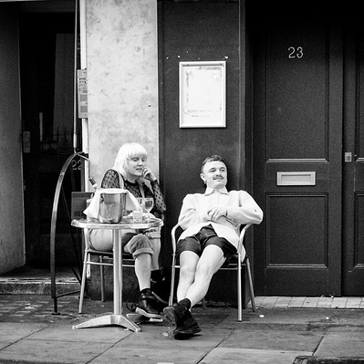 A couple watching the world go by East London black-and-white for photography