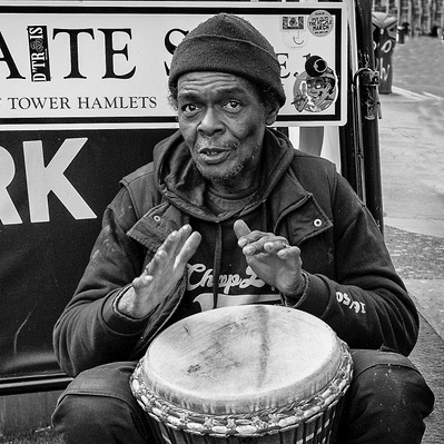 Busker playing the bongos in East London, Black and White photography 