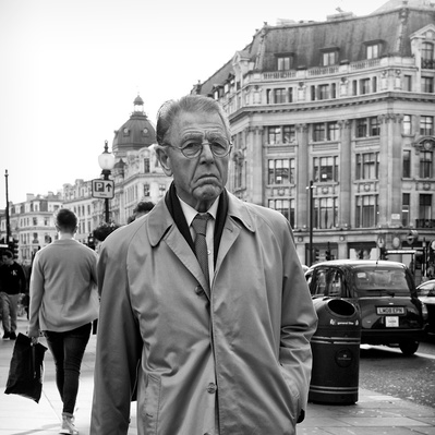 Actual Edward Fox walking along Regent Street, London black-and-white photography