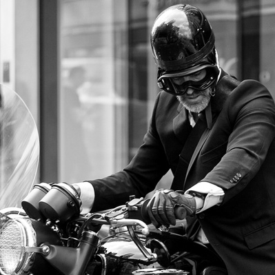 A City gent on his motorcycle, London black-and-white photograph photography