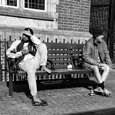 Two men on a bench, London black-and-white for photography